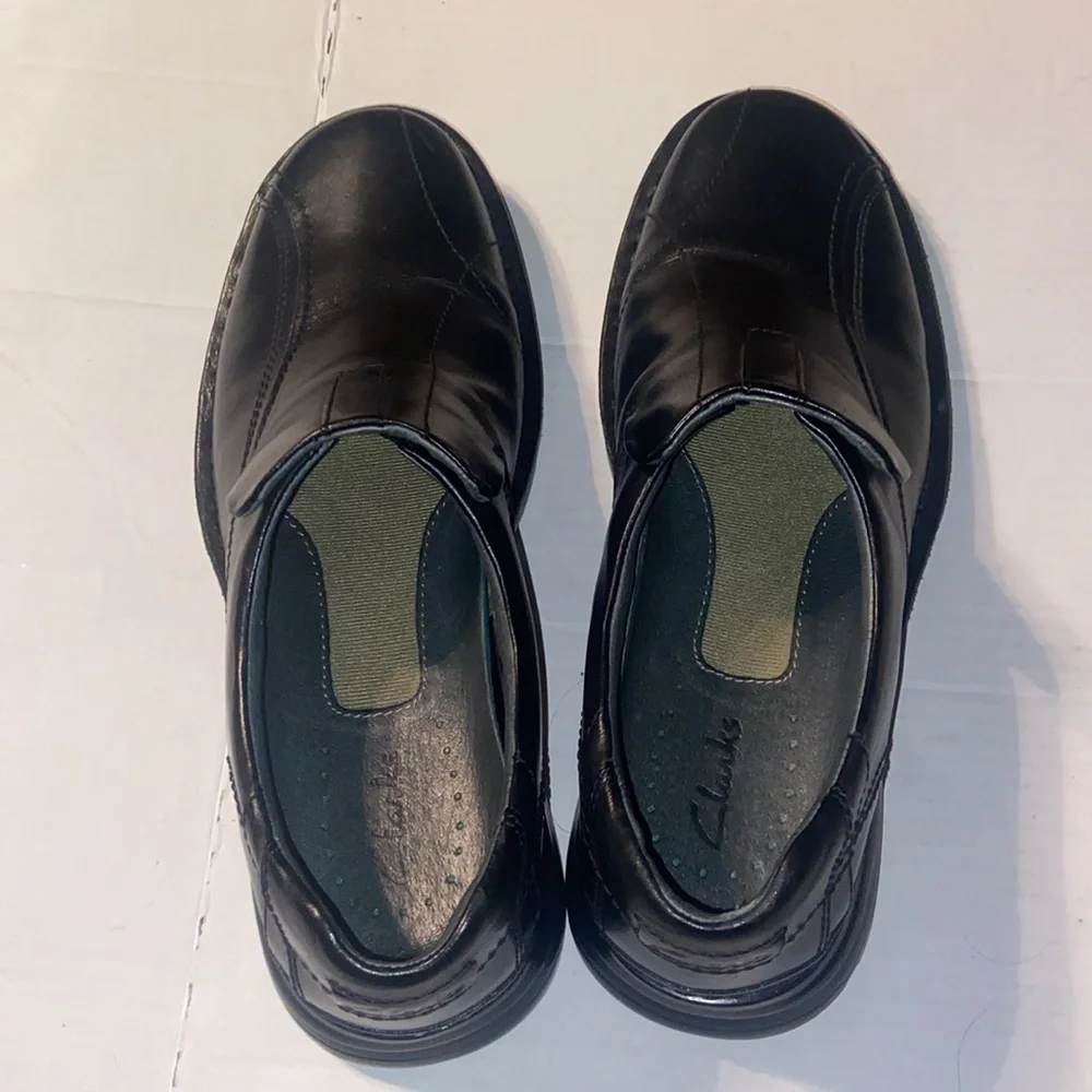 Clarks Escalate black slip on loafers size 10M with original box.